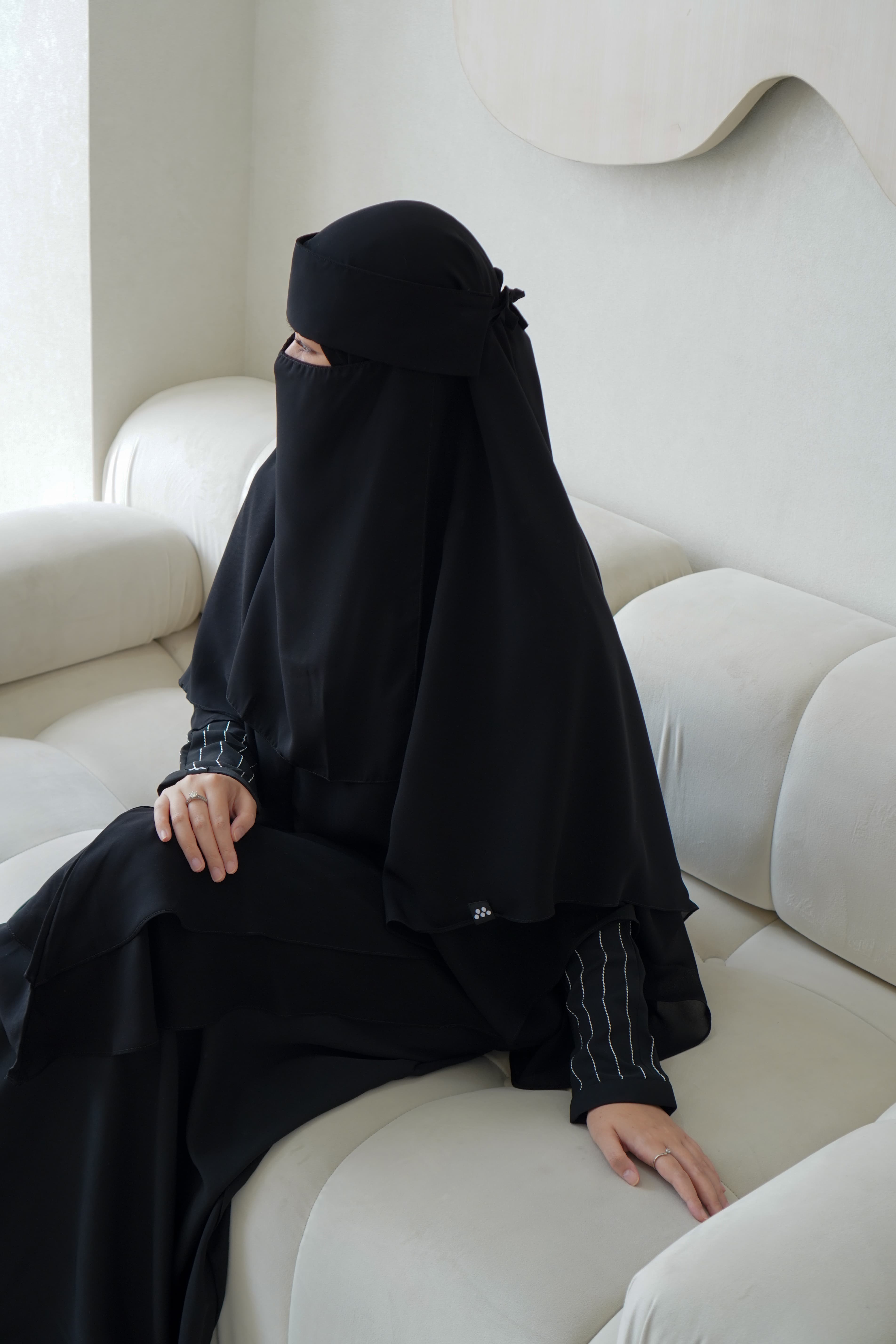 The Signature Black Abaya — studio portrait